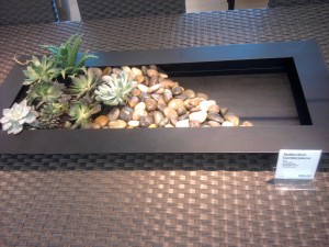 "Rustic Planter" A simple metal planter with some stones and succulent plants arranged in it to look carefree.