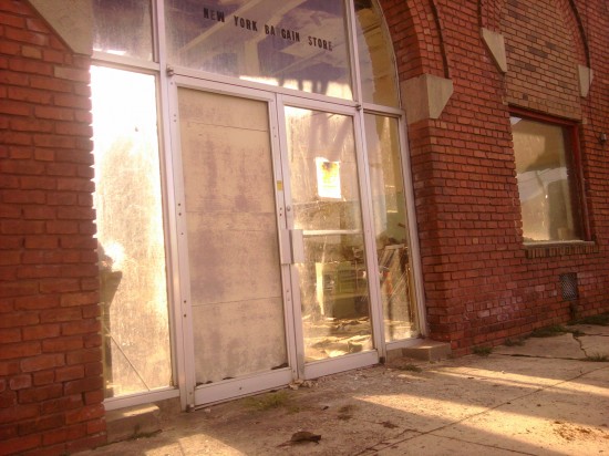 Store front Light shines through a vacant storefront in post-huricane Irene Enfield, NC.