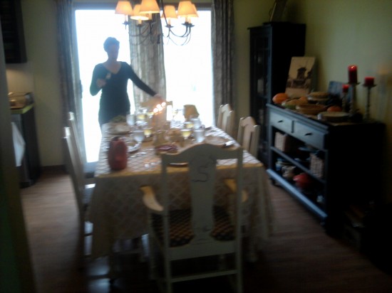 Setting the Table My sister, overseeing the Thanksgiving table.